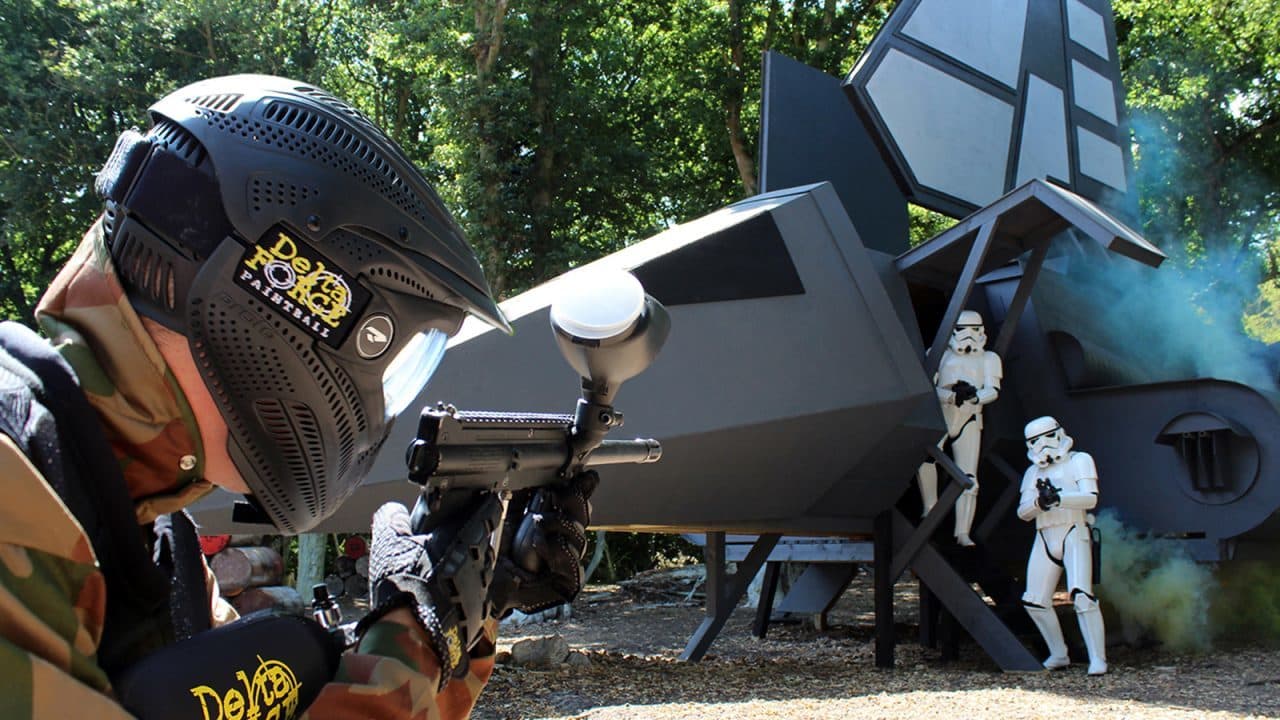 A player beside a spacecraft in the Space Warz game zone